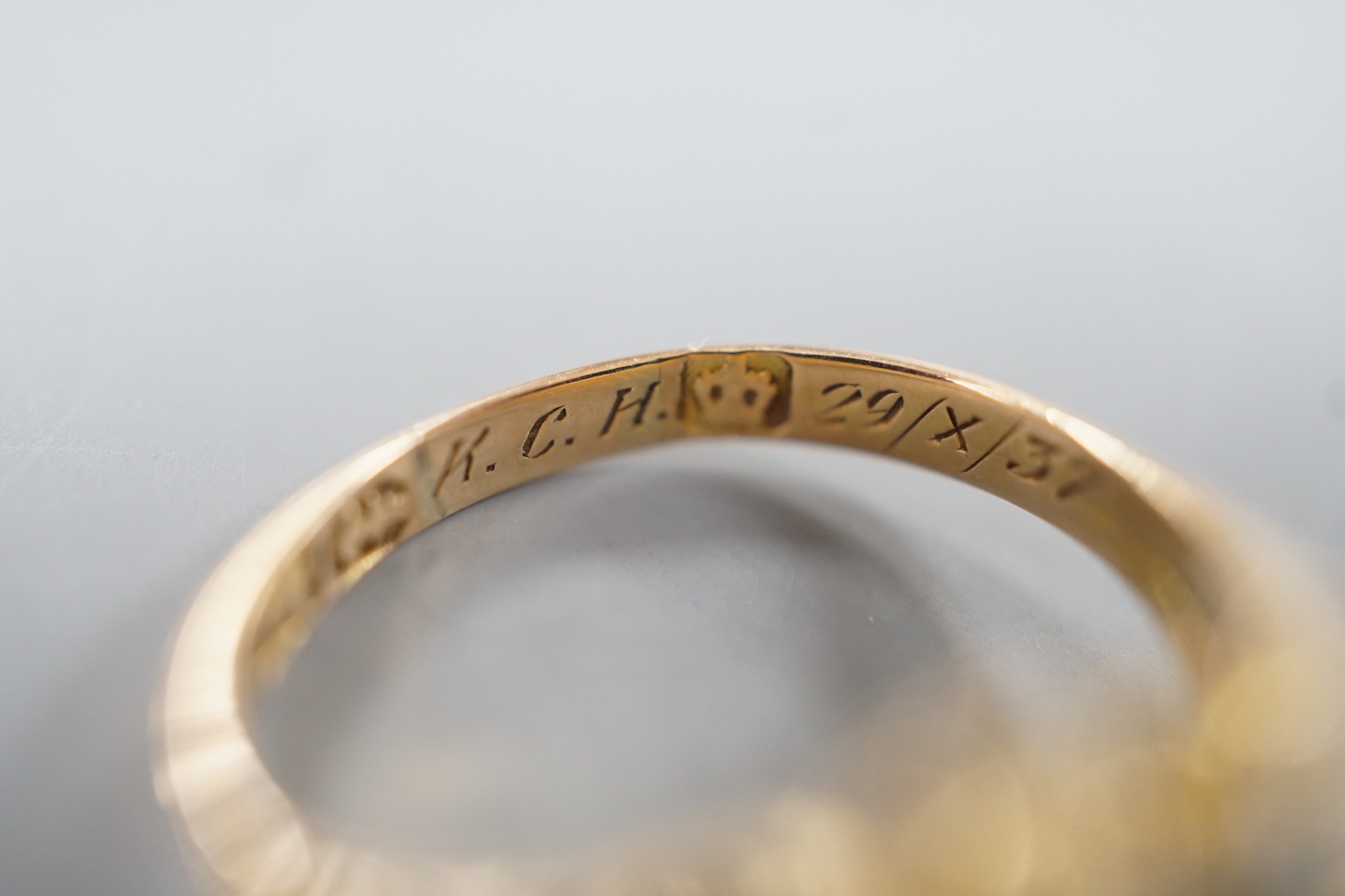 A late Victorian gold, emerald and split pearl cluster set ring, with later engraved inscription, size N, gross weight 2.9 grams.